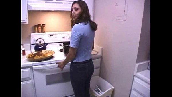 Brunette strips and sucks cock